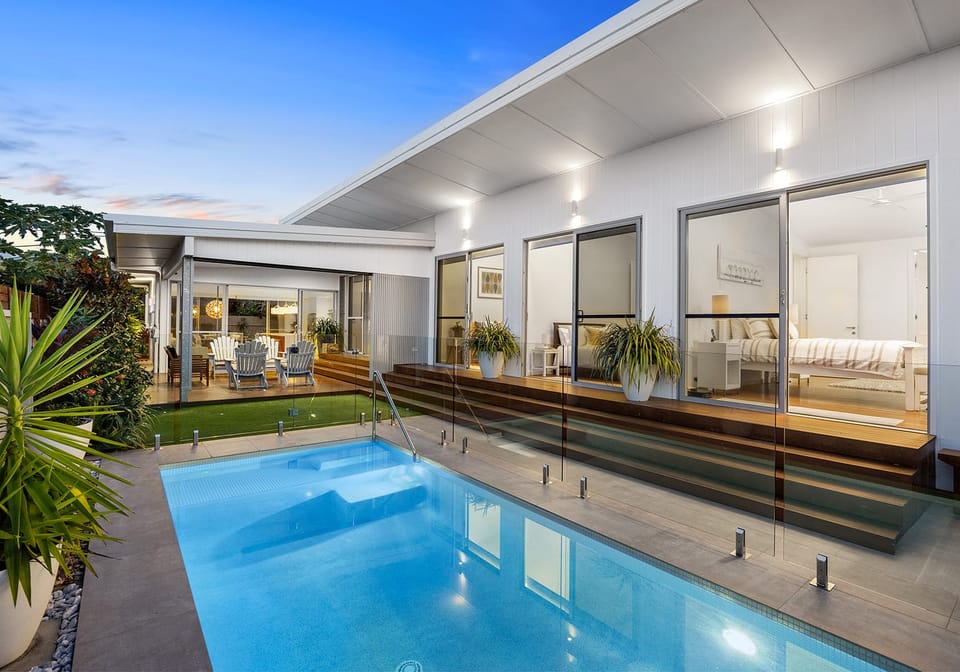 Immaculate Single Level Beachside Living in Private Enclave