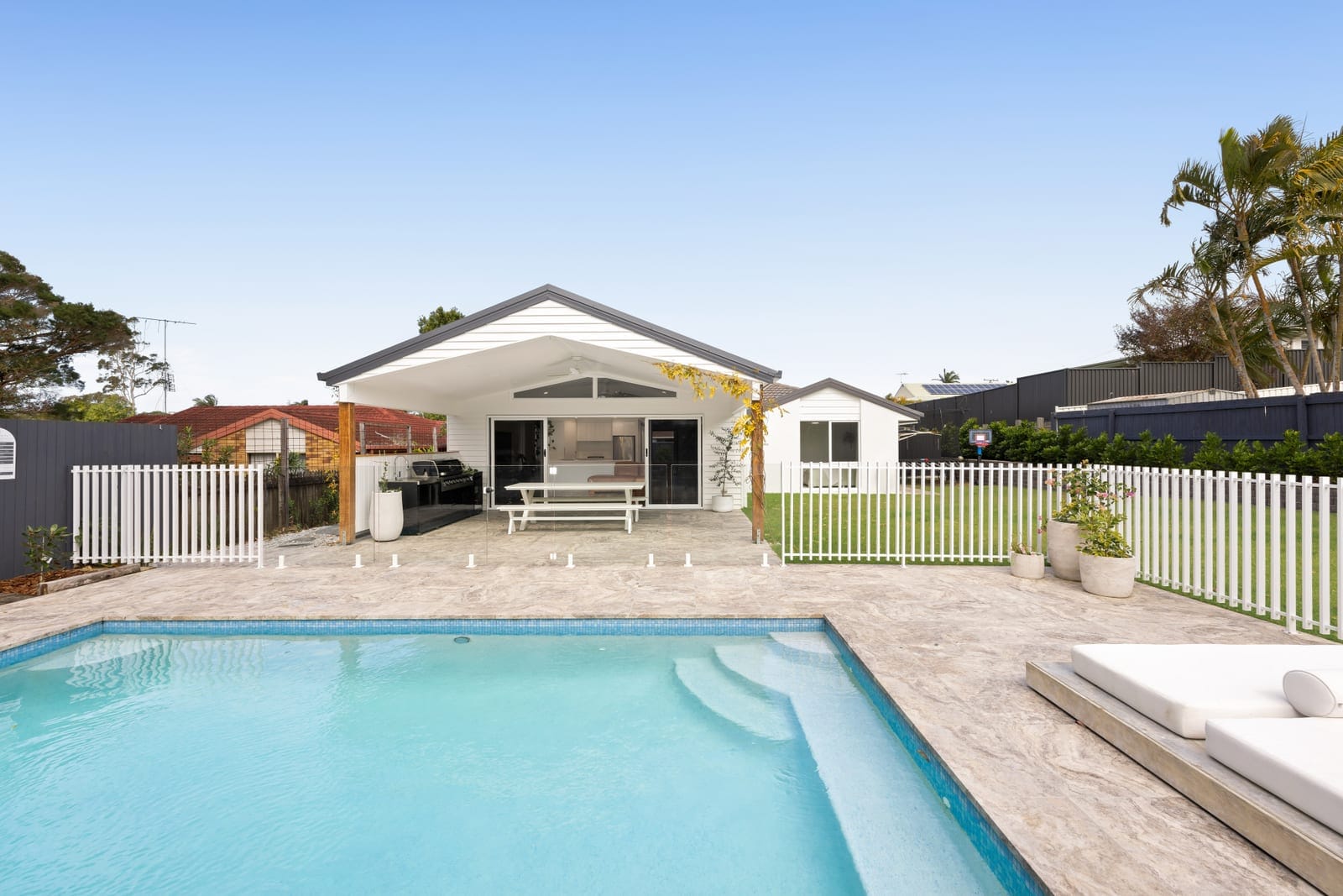 North-Facing Entertaining, Poolside Living & Room for All the Toys!